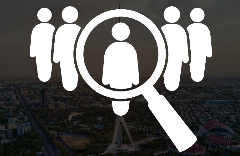 Magnifying glass over silhouettes of people Tashkent in background